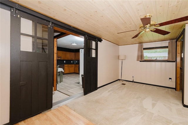 68 Riverside Ave, Center Twp/Homer Cty, PA 15748 - carpeted empty room with a barn door, wooden ceiling, and a ceiling fan