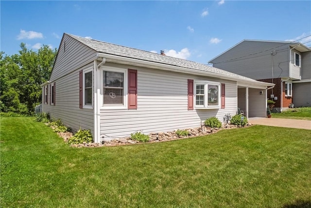 1434 Washington Blvd, Port Vue, PA 15133 - view of front of house with a front yard, driveway, and roof with shingles