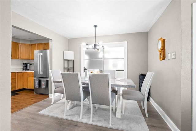 1434 Washington Blvd, Port Vue, PA 15133 - dining space featuring wood finished floors and a chandelier