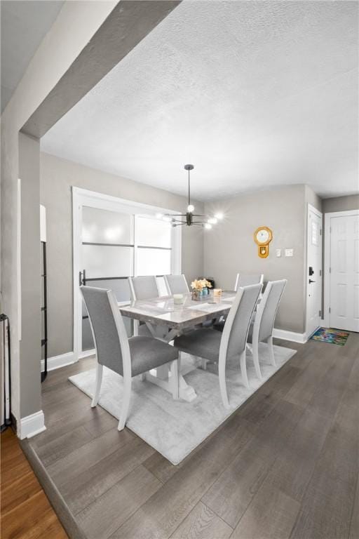 1434 Washington Blvd, Port Vue, PA 15133 - dining area with a chandelier, wood finished floors, and a textured ceiling