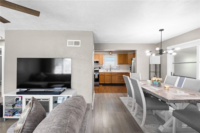 1434 Washington Blvd, Port Vue, PA 15133 - dining area with wood finished floors, a chandelier, and ceiling fan