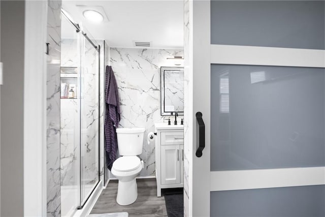 1434 Washington Blvd, Port Vue, PA 15133 - full bath with vanity, tile walls, a marble finish shower, and wood finished floors