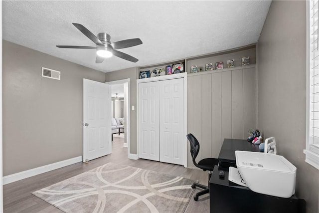 1434 Washington Blvd, Port Vue, PA 15133 - home office with ceiling fan, wood finished floors, and a textured ceiling