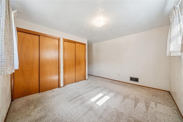 172 Fox Chase Dr, Penn Hills, PA 15147 - unfurnished bedroom featuring two closets and carpet floors