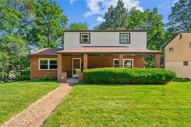 172 Fox Chase Dr, Penn Hills, PA 15147 - traditional-style house with a front yard and brick siding