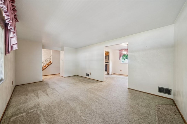 172 Fox Chase Dr, Penn Hills, PA 15147 - spare room featuring carpet and stairway