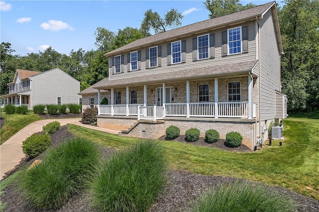 3013 Chessman St, Hampton, PA 15101 - colonial-style house featuring covered porch, a front lawn, and brick siding