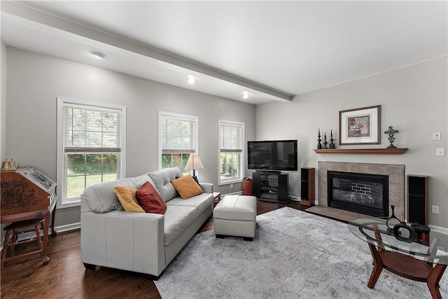 3013 Chessman St, Hampton, PA 15101 - living area with wood finished floors, a tiled fireplace, and beamed ceiling