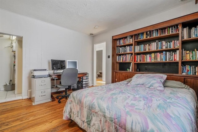 6403 Beacon St, Squirrel Hill, PA 15217 - bedroom featuring wood finished floors, a textured ceiling, and an office area