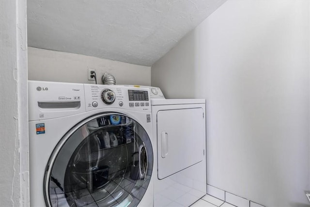 6403 Beacon St, Squirrel Hill, PA 15217 - laundry area with washer and dryer, tile patterned flooring, and a textured ceiling