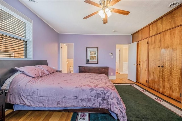 6403 Beacon St, Squirrel Hill, PA 15217 - bedroom with light wood-type flooring, ornamental molding, connected bathroom, and a ceiling fan