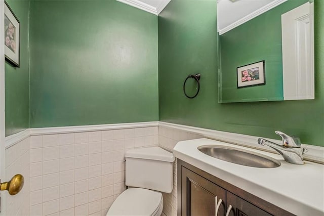 6403 Beacon St, Squirrel Hill, PA 15217 - half bath featuring ornamental molding, vanity, a wainscoted wall, and tile walls