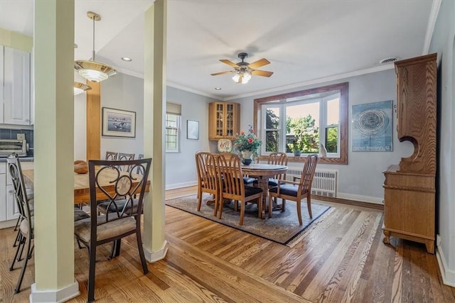 6403 Beacon St, Squirrel Hill, PA 15217 - dining space with light wood finished floors, crown molding, radiator, a ceiling fan, and recessed lighting