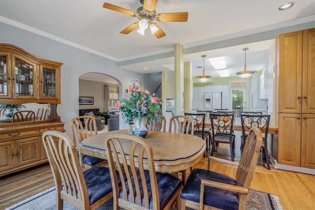 6403 Beacon St, Squirrel Hill, PA 15217 - dining area with arched walkways, ceiling fan, light wood finished floors, and ornamental molding