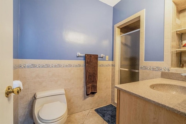 6403 Beacon St, Squirrel Hill, PA 15217 - full bath featuring tile walls, vanity, a stall shower, wainscoting, and tile patterned floors