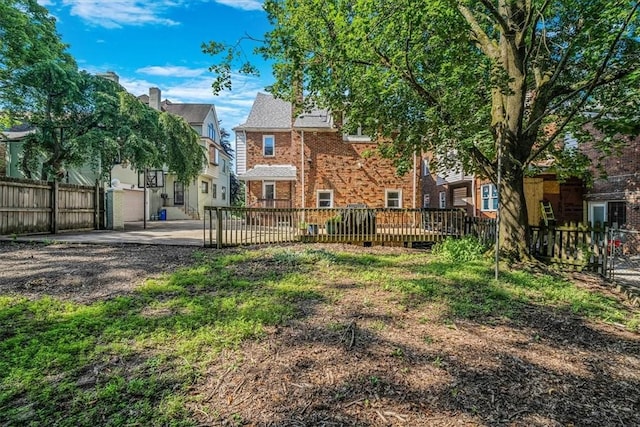 6403 Beacon St, Squirrel Hill, PA 15217 - rear view of house featuring brick siding, a wooden deck, and a patio
