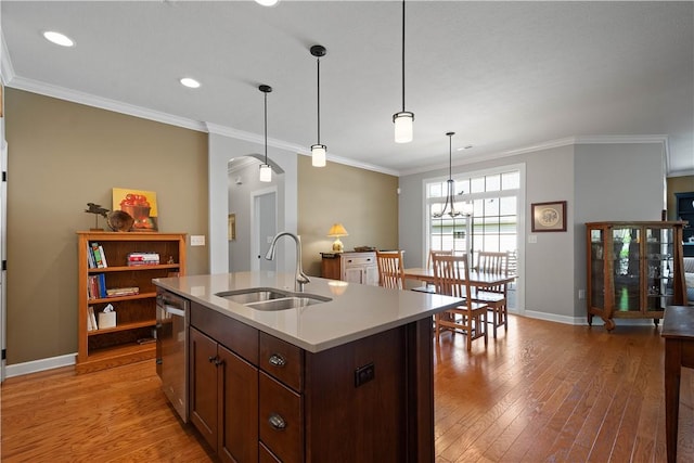 517 Altmyer Fields Ln, Marshall, PA 15090 - kitchen featuring arched walkways, light wood-style flooring, light countertops, pendant lighting, and ornamental molding
