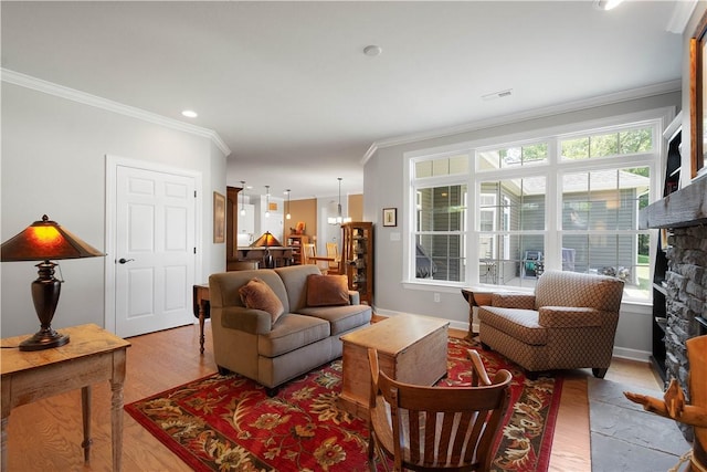 517 Altmyer Fields Ln, Marshall, PA 15090 - living area featuring crown molding, a stone fireplace, light wood-style floors, and a chandelier