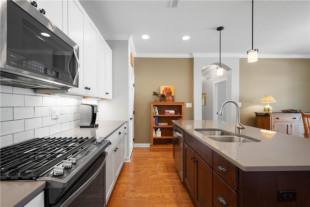 517 Altmyer Fields Ln, Marshall, PA 15090 - kitchen with appliances with stainless steel finishes, crown molding, white cabinetry, backsplash, and light wood-style floors