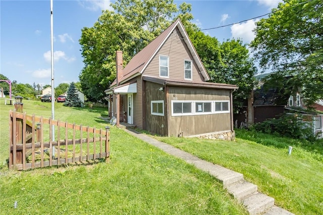 133 2nd, St, PA 15961 - view of property exterior with a chimney and a lawn