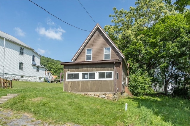133 2nd, St, PA 15961 - rear view of property featuring a lawn