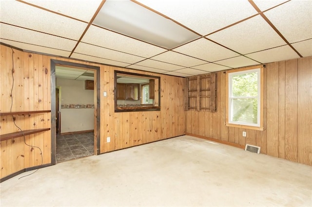 133 2nd, St, PA 15961 - unfurnished room featuring a paneled ceiling, wood walls, and carpet