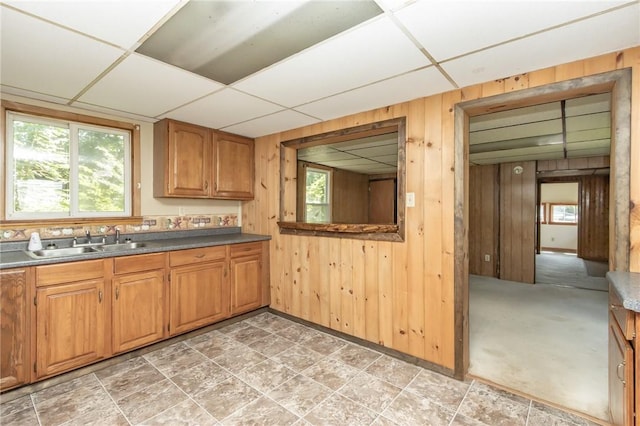 133 2nd, St, PA 15961 - kitchen with a paneled ceiling, wood walls, brown cabinetry, and dark countertops