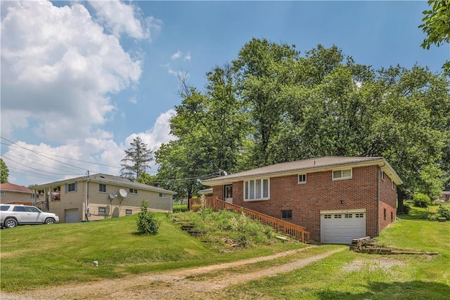 391 Wendel Rd, Pa, PA 15642 - ranch-style home featuring brick siding, a garage, a front lawn, dirt driveway, and stairs