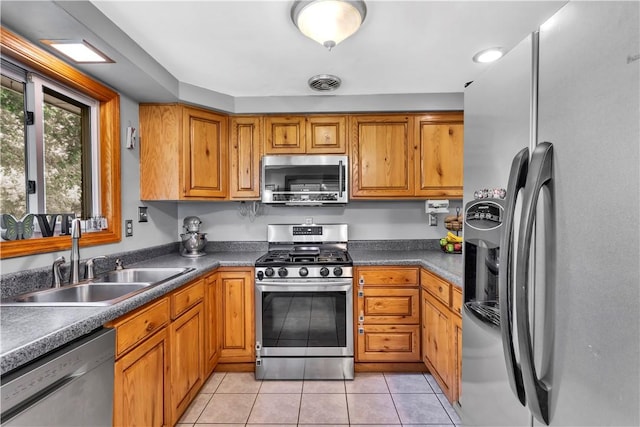 391 Wendel Rd, Pa, PA 15642 - kitchen featuring appliances with stainless steel finishes, brown cabinets, and light tile patterned flooring