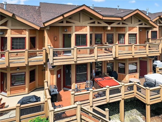 116 Lakeside Trl, Seven Springs Resort, PA 15622 - rear view of property with board and batten siding, roof with shingles, and a balcony