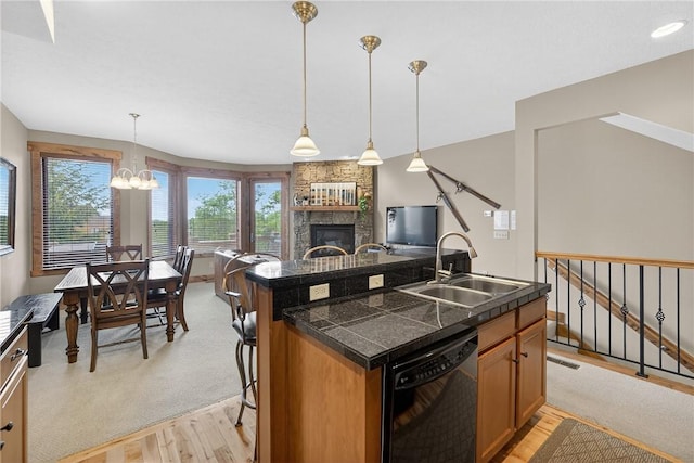 116 Lakeside Trl, Seven Springs Resort, PA 15622 - kitchen featuring black dishwasher, tile counters, light wood-type flooring, and a kitchen island with sink