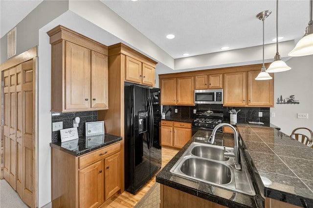 116 Lakeside Trl, Seven Springs Resort, PA 15622 - kitchen with black appliances, tile countertops, backsplash, light wood-style flooring, and pendant lighting