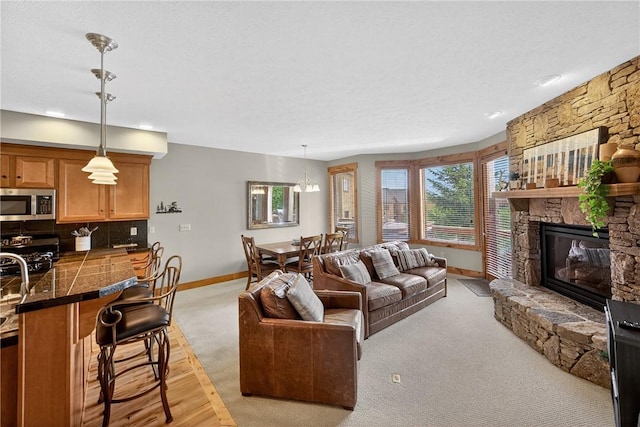 116 Lakeside Trl, Seven Springs Resort, PA 15622 - living room with light carpet and a fireplace