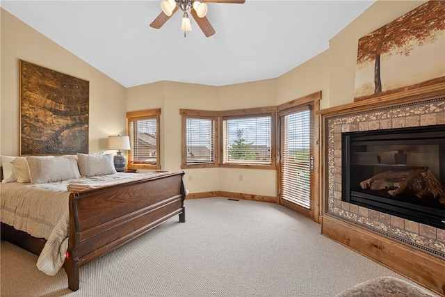 116 Lakeside Trl, Seven Springs Resort, PA 15622 - bedroom featuring light carpet, a glass covered fireplace, ceiling fan, and access to outside
