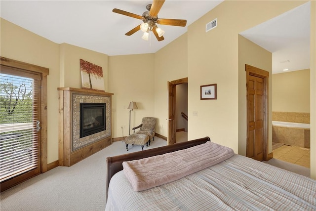 116 Lakeside Trl, Seven Springs Resort, PA 15622 - carpeted bedroom featuring a fireplace, access to exterior, ensuite bathroom, and ceiling fan