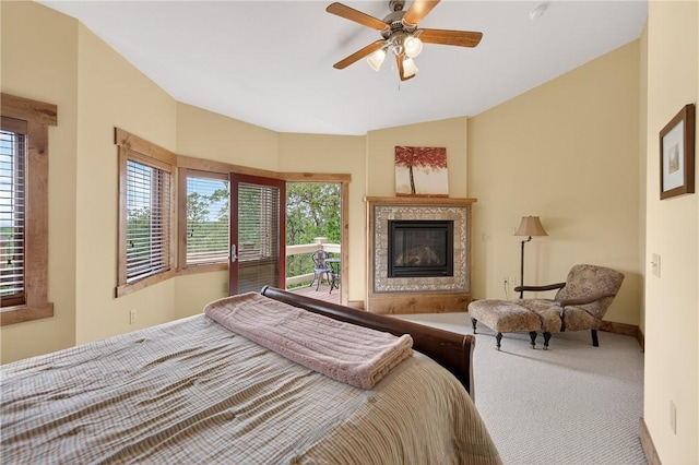 116 Lakeside Trl, Seven Springs Resort, PA 15622 - bedroom with a tile fireplace, carpet, and ceiling fan