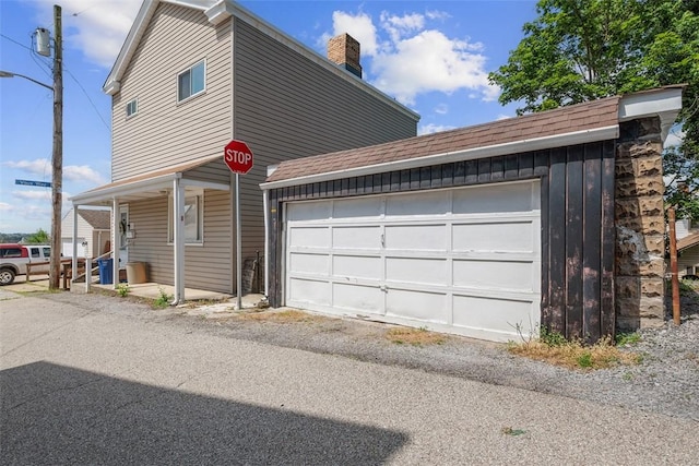 123 Labelle St, Mt Washington, PA 15211 - view of front of house with a chimney, a garage, a shingled roof, and a porch