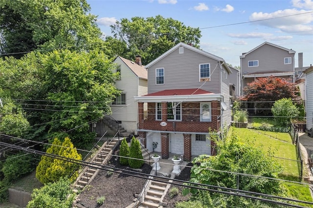 123 Labelle St, Mt Washington, PA 15211 - view of front of house with stairway, brick siding, and a fenced backyard