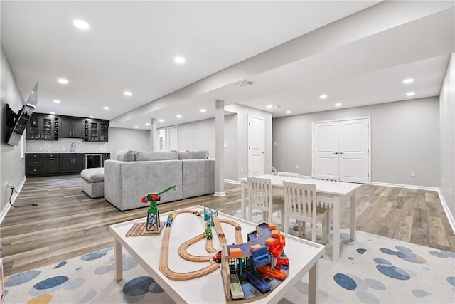 3049 Eagle Ridge Dr, Middlesex Twp, PA 16059 - living room featuring light wood-style flooring, recessed lighting, and bar