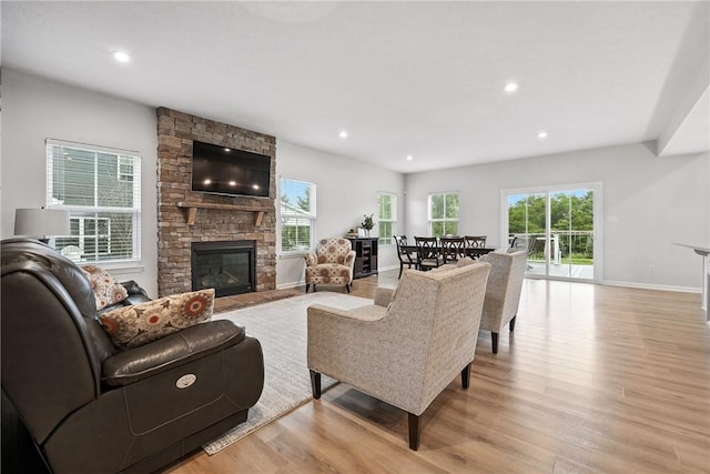 3049 Eagle Ridge Dr, Middlesex Twp, PA 16059 - living room with a stone fireplace, light wood finished floors, and recessed lighting