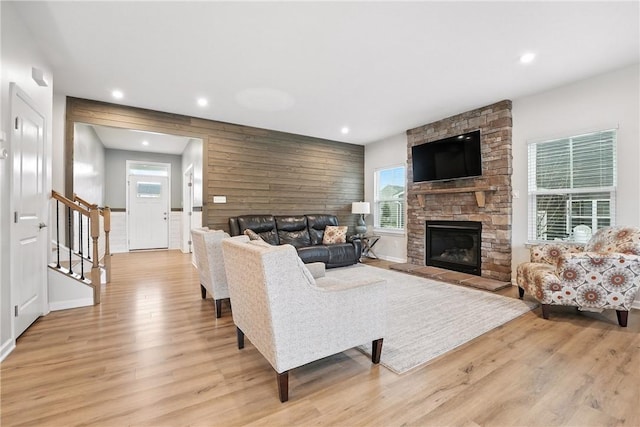 3049 Eagle Ridge Dr, Middlesex Twp, PA 16059 - living area with light wood finished floors, recessed lighting, a stone fireplace, and stairway