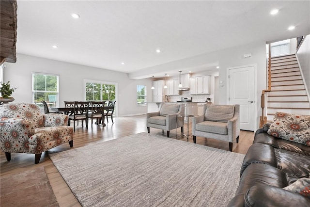 3049 Eagle Ridge Dr, Middlesex Twp, PA 16059 - living area with healthy amount of natural light, stairs, light wood-type flooring, and recessed lighting