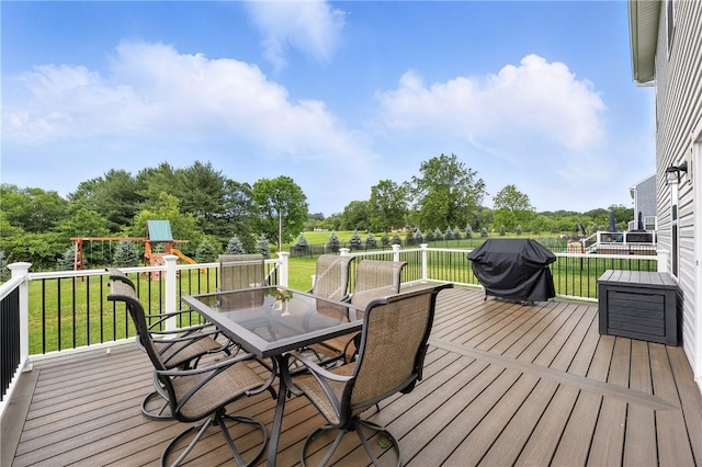 3049 Eagle Ridge Dr, Middlesex Twp, PA 16059 - deck with a playground, a grill, outdoor dining space, a lawn, and view of scattered trees