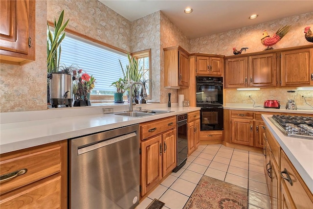 410 Lorenzo Ln, Hempfield Twp, PA 15642 - kitchen featuring stainless steel appliances, light countertops, light tile patterned floors, brown cabinets, and recessed lighting