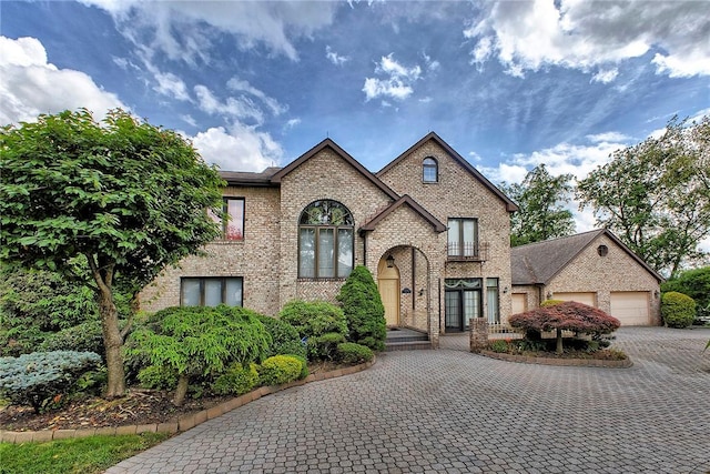 410 Lorenzo Ln, Hempfield Twp, PA 15642 - view of front of property with brick siding and decorative driveway