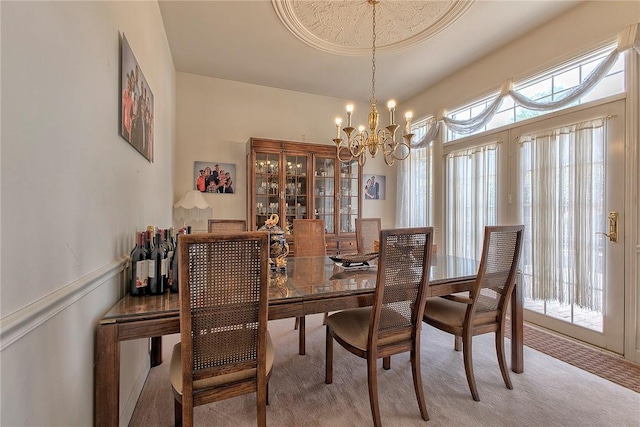 410 Lorenzo Ln, Hempfield Twp, PA 15642 - dining area featuring light colored carpet, a chandelier, and plenty of natural light