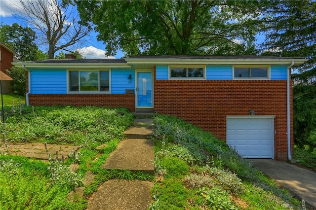 1117 Meadowlark Dr, Pittsburgh, PA 15243 - view of front of house with brick siding, an attached garage, concrete driveway, and a chimney