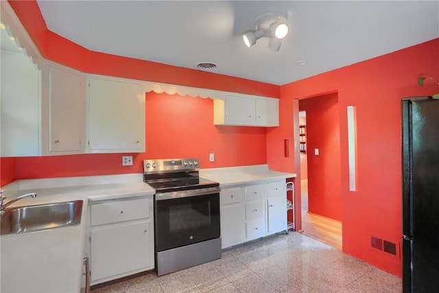 1117 Meadowlark Dr, Pittsburgh, PA 15243 - kitchen featuring electric stove, freestanding refrigerator, granite tiled floors, light countertops, and white cabinets
