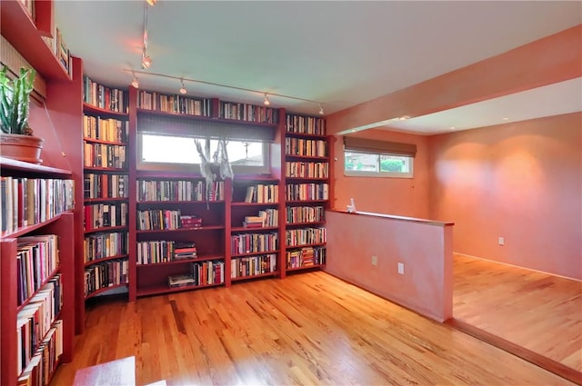 1117 Meadowlark Dr, Pittsburgh, PA 15243 - sitting room featuring wall of books and wood finished floors