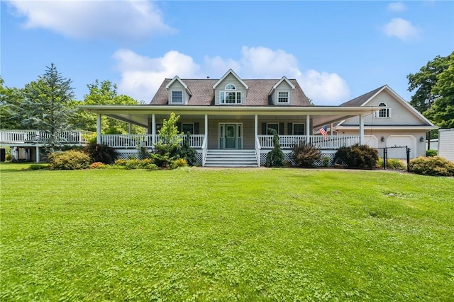 409 Park Rd, Bullskin Twp, PA 15683 - farmhouse featuring covered porch, a front yard, and an attached garage